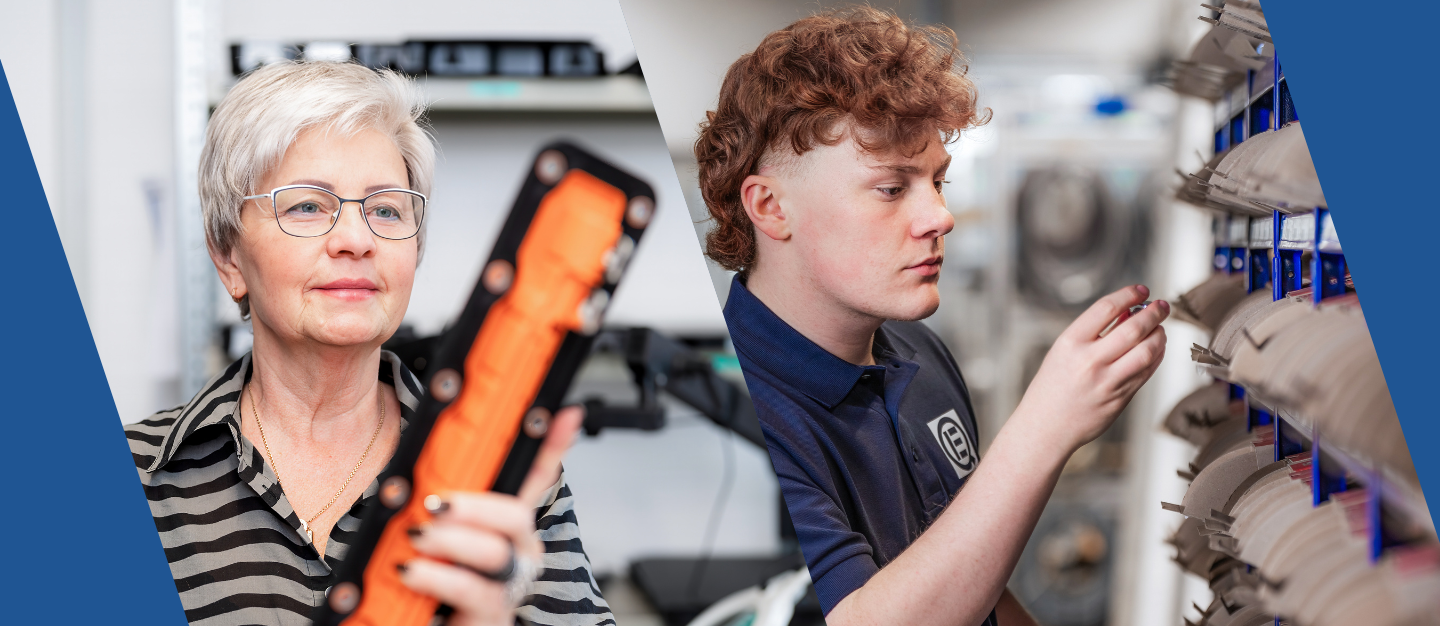 Eine ältere Frau mit Brille betrachtet konzentriert ein technisches Bauteil in Orange